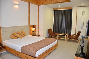 Mayur Hotel in Solan, image may contain: Hotel, Furniture, Interior Design, Chair