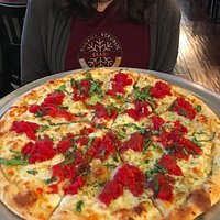 asiago cheese, tomato, basil & herbs- delicious pizza at fetta's
