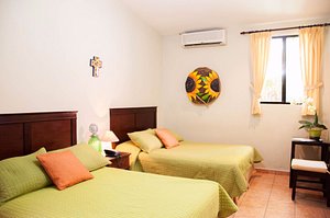 Hotel La Posada Del Angel in San Salvador, image may contain: Furniture, Bedroom, Bed, Dorm Room