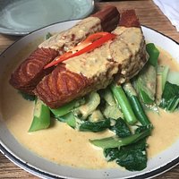 Salmon in curry sauce with fresh Asian vegetables