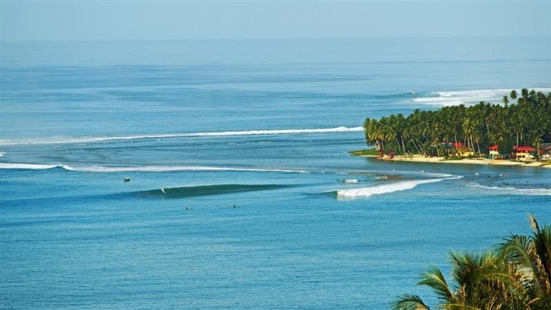 World class waves of Lagundri Bay directly out front of resort
