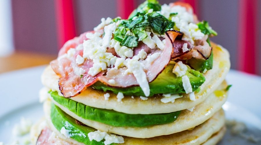 Pancakes, avocado, bacon, feta cheesse, lime