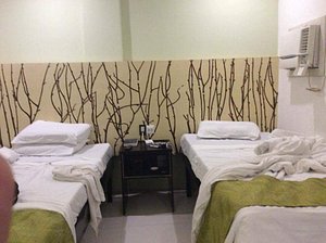 Hotel Camila in Mindanao, image may contain: Dorm Room, Bed, Hostel, Hospital
