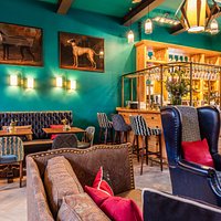 Pull up a chair by the fire in The Mess Bar