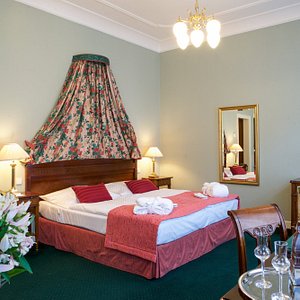 Hotel Liberty in Prague, image may contain: Lamp, Furniture, Table Lamp, Chandelier