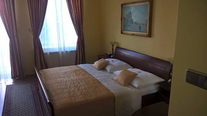 Hotel Carpe Diem in Presov, image may contain: Bed, Furniture, Home Decor, Rug