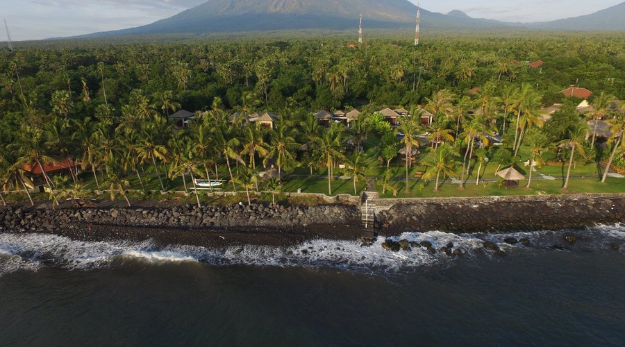 Aerial resort view - right on the beach in a tropical garden