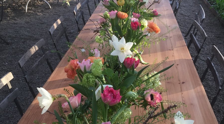 The greenhouse is set for an event, flowers Rosendals Gardens florists.