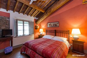 Al Podere di Rosa in Lucca, image may contain: Loft, Indoors, Housing, Bed