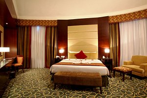 Concorde Hotel Fujairah in Fujairah, image may contain: Home Decor, Hotel, Furniture, Bed