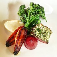 Hazelnut encrusted roe deer with roast carrots, poached baby pear and Celeriac puree