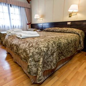 The Double Standard Room with Extra Bed at the Villa Brescia Hotel