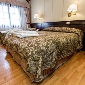 The Double Standard Room with Extra Bed at the Villa Brescia Hotel