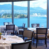 Breathtaking views of Vancouver's inner harbor, Stanley Park and local mountains.