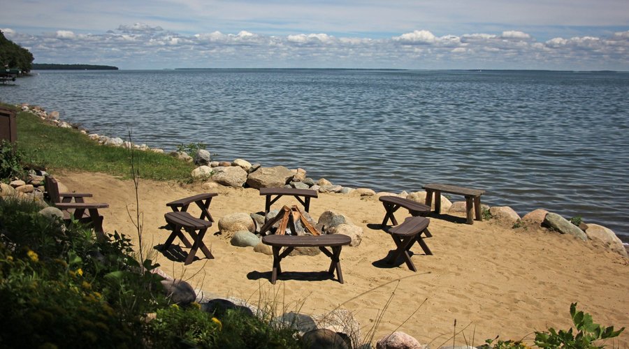 Large bonfire pits located along the shoreline for all guests