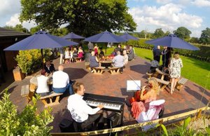 Oak Farm Hotel in Hatherton, image may contain: Piano, Concert, Person, Man