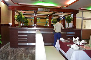 Hotel Theja Fort in Dimapur, image may contain: Restaurant, Cafeteria, Table, Cup
