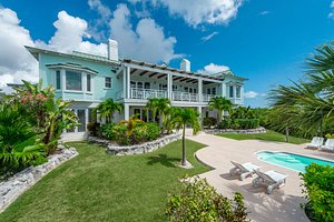 The Abaco Club on Winding Bay in Great Abaco Island, image may contain: Villa, Resort, Hotel, Grass