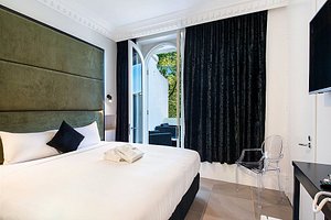 Sydney Boutique Hotel in Sydney, image may contain: Interior Design, Bed, Furniture, Chair