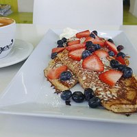 Pancackes with cream cheese & berries. And, of course, a hot cup of freshly brewed coffee.