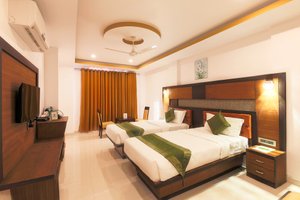 Treebo Tryst Palmyra Milford in Alappuzha, image may contain: Resort, Hotel, Corner, Interior Design