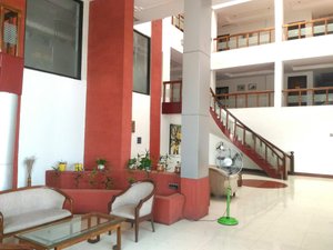 Hotel Golden Anchor in Paradeep, image may contain: Chair, Indoors, Staircase, Living Room