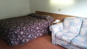 Stardust Motel Bedford in Bedford, image may contain: Couch, Furniture, Bed, Bedroom