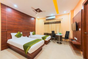 Treebo Trend Globe International in Kolkata (Calcutta), image may contain: Interior Design, Resort, Hotel, Ceiling Fan