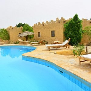 one of the two swimming pools أحد حمامي السباحة بالفندق