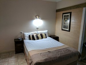 Aspect Central Motel in Cairns, image may contain: Furniture, Bed, Bedroom, Indoors