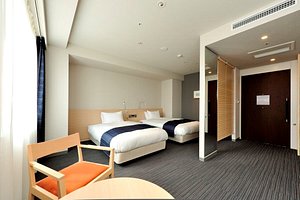 JR Kyushu Hotel Miyazaki in Miyazaki, image may contain: Bed, Furniture, Hotel, Bedroom
