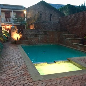 Quaint center courtyard with pool and hot tub.