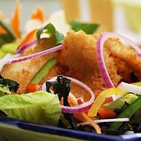 Crispy deep fried cod fish salad flavoured with green apples,peanuts, lime juice and chilli dres
