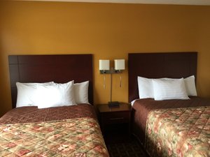 Park Place Motel in Tweed, image may contain: Bed, Furniture, Cushion, Bedroom