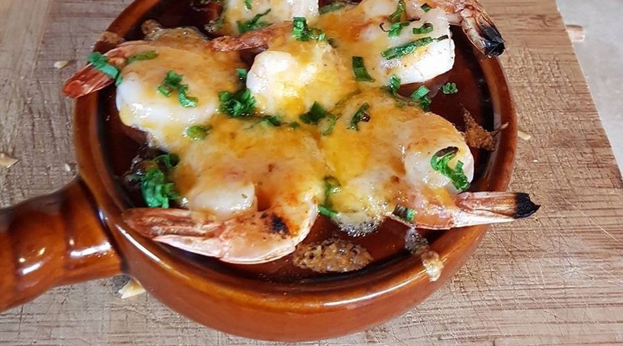 Large shrimp brushed with garlic butter, little spice to warm it up, topped with a cheese blend 