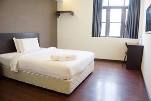 Orange Hotels Kuchai Lama in Kuala Lumpur, image may contain: Furniture, Bed, Bedroom, Room