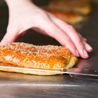 Rhubarb Danish being cut 8.10am