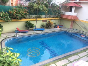 Thushara Hotel in Kovalam, image may contain: Hotel, Resort, Pool, Water