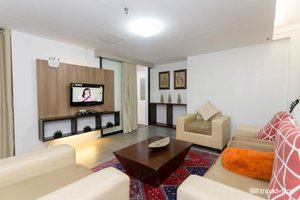 Travelbee Business Inn in Cebu Island, image may contain: Living Room, Monitor, Screen, Couch