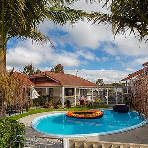 Summit Motor Lodge in Tauranga, image may contain: Hotel, Resort, Villa, Pool