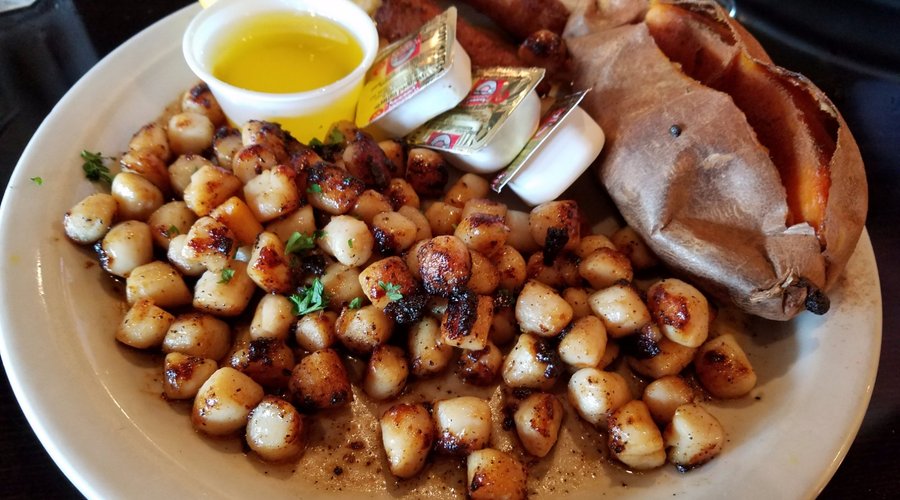 Broiled Bay scallops with baked sweet potato & hush puppy