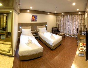 Hotel Benzz Park Vellore in Vellore, image may contain: Hotel, Flooring, Resort, Cup
