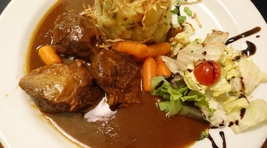 Pork on dark beer sauce