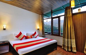 Aadrika Retreat in Naukuchiatal, image may contain: Resort, Hotel, Interior Design, Furniture