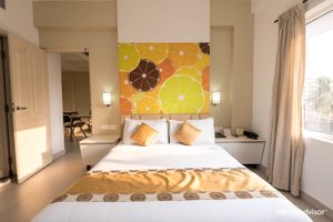 Hotel Millennium Continental in Ernakulam, image may contain: Furniture, Home Decor, Interior Design, Bed