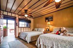Utila Lodge in Utila, image may contain: Dorm Room, Bedroom, Room, Ceiling Fan