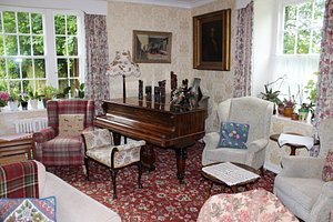 Lastingham Grange in Lastingham, image may contain: Home Decor, Living Room, Piano, Couch