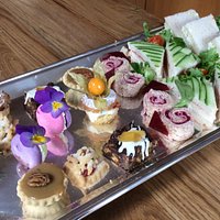 Selection of cakes and sandwiches