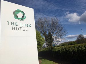The Link Hotel in Loughborough, image may contain: Hedge, Advertisement, Logo, Grass