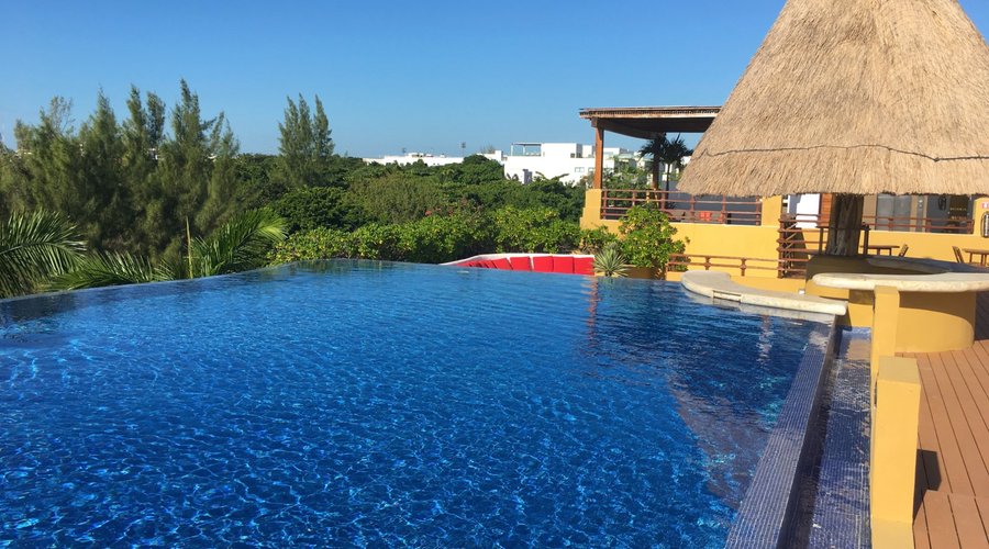 The rooftop infinity pool is adults only and features a very spacious lounging area.